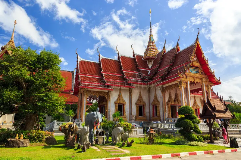 Wat Chalong’s golden and white temple shining in the sunlight.